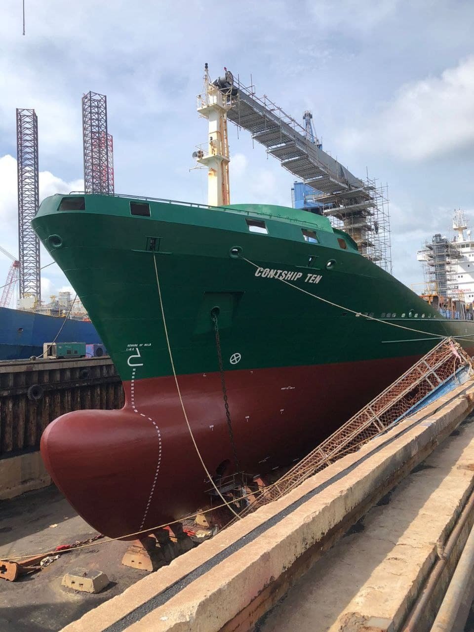 Ship in drydock for hull inspection at a Batam shipyard